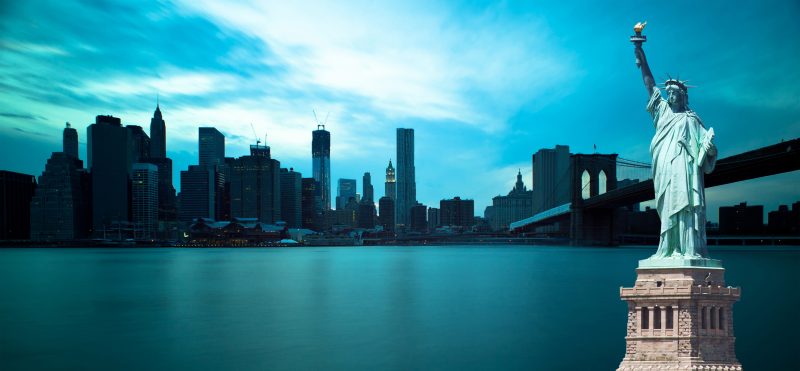 Brooklyn Bridge and Manhattan Skyline with the Statue of Liberty